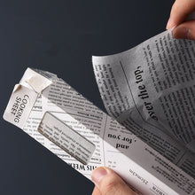 נייר אריזה בדקורציית עיתון